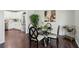 Dining room with hardwood floors and a table adjacent to the kitchen at 2284 Briarwood Cir, Conyers, GA 30094