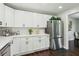 Bright kitchen featuring white cabinets, stainless steel appliances, and modern fixtures at 2284 Briarwood Cir, Conyers, GA 30094