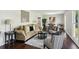 Spacious living room with a decorative mirror and chair next to the dining area at 2284 Briarwood Cir, Conyers, GA 30094