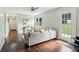Open-concept living room featuring hardwood floors and a door leading to the backyard at 2284 Briarwood Cir, Conyers, GA 30094