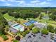 Sprawling aerial view showcasing the golf course, tennis courts, pool and parking lot at 3770 Clubland Trl, Marietta, GA 30068