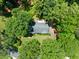 Aerial view of a home with a gray roof surrounded by lush greenery and trees at 3770 Clubland Trl, Marietta, GA 30068