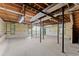 Unfinished basement with exposed beams and support columns, offering a blank canvas for customization and expansion at 3770 Clubland Trl, Marietta, GA 30068