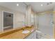 This bathroom offers a white sink with granite countertop and a tiled shower behind a sliding glass door at 3770 Clubland Trl, Marietta, GA 30068