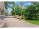 Cozy backyard wooden deck with bench seating surrounded by lush greenery at 3770 Clubland Trl, Marietta, GA 30068