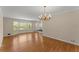 Elegant dining area with hardwood floors, a bay window, and a chandelier at 3770 Clubland Trl, Marietta, GA 30068