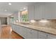 Kitchen boasts white cabinets, granite counters, and ample storage space at 3770 Clubland Trl, Marietta, GA 30068