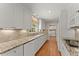 Modern kitchen featuring white cabinets, granite countertops, and stainless steel appliances at 3770 Clubland Trl, Marietta, GA 30068