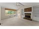 Spacious living room with a brick fireplace and abundant natural light at 3770 Clubland Trl, Marietta, GA 30068