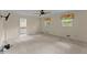 Spacious main bedroom with two windows, carpet, and a ceiling fan at 3770 Clubland Trl, Marietta, GA 30068