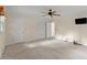 This main bedroom features a ceiling fan, white closet doors, and a wall mounted television at 3770 Clubland Trl, Marietta, GA 30068