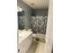 Clean bathroom with a white vanity, a large mirror, and a shower/tub combo with a decorative curtain at 320 Orleans Blvd, Mcdonough, GA 30253