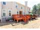 Townhome backyard featuring a wooden deck, well-maintained lawn and mature trees at 4766 Longcourt Se Dr # 23, Atlanta, GA 30339