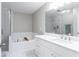 Bright bathroom featuring a soaking tub, glass enclosed shower, and a double vanity at 4766 Longcourt Se Dr # 23, Atlanta, GA 30339