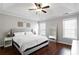 Spacious bedroom with tray ceilings, hardwood floors, and plenty of natural light at 4766 Longcourt Se Dr # 23, Atlanta, GA 30339