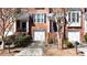 Attractive brick townhome showcasing attached garages and landscaped front yards at 4766 Longcourt Se Dr # 23, Atlanta, GA 30339