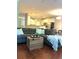 Living room area with a large sectional sofa, hardwood floors, and open layout at 4766 Longcourt Se Dr # 23, Atlanta, GA 30339