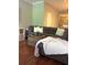 Living room features a sectional sofa, hardwood floors, and view of staircase at 4766 Longcourt Se Dr # 23, Atlanta, GA 30339