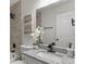 Bathroom featuring granite counters, a modern sink, and tile walls, plus a white orchid at 4912 Bayside Ct, Stone Mountain, GA 30088