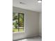 Bedroom featuring a bright window, grey walls, and neutral carpet at 4912 Bayside Ct, Stone Mountain, GA 30088