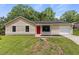 Charming one-story home with a bright red front door and a well-maintained front yard at 4912 Bayside Ct, Stone Mountain, GA 30088