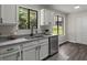Modern kitchen with granite counters, stainless steel appliances, and ample natural light at 4912 Bayside Ct, Stone Mountain, GA 30088