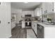 Modern kitchen features stainless steel appliances, granite counters, and ample cabinet space at 4912 Bayside Ct, Stone Mountain, GA 30088