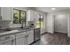 Bright kitchen featuring granite counters, stainless appliances, and a view to the outdoors at 4912 Bayside Ct, Stone Mountain, GA 30088
