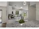 Well-lit kitchen with stainless steel appliances, granite counters, and white cabinets at 4912 Bayside Ct, Stone Mountain, GA 30088
