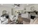 Open living room with modern decor, a stone fireplace, and views to the dining area and backyard at 4912 Bayside Ct, Stone Mountain, GA 30088