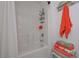 Bright bathroom features a shower/tub combo with a white shower curtain and a shower caddy at 510 Pineland Sw Rd, Mableton, GA 30126