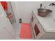 Unique powder room boasts an antique metal bowl sink, white vanity, and charming decor details at 510 Pineland Sw Rd, Mableton, GA 30126