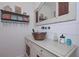 This powder room offers a unique copper sink and white shiplap walls at 510 Pineland Sw Rd, Mableton, GA 30126