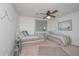 Bright bedroom with two twin beds, neutral decor and coastal artwork and accents at 510 Pineland Sw Rd, Mableton, GA 30126