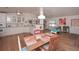 Open dining area with hardwood floors, seamlessly connecting the kitchen and living spaces, great for entertaining at 510 Pineland Sw Rd, Mableton, GA 30126
