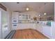 This spacious kitchen offers white cabinetry, modern appliances, and access to the outdoor deck at 510 Pineland Sw Rd, Mableton, GA 30126