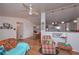 Spacious living area showcasing hardwood floors, stylish furnishings, and seamless flow to the dining area at 510 Pineland Sw Rd, Mableton, GA 30126