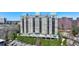 Expansive aerial view of the modern highrise condominium building with multiple terraces at 2700 Paces Ferry Se Rd # 202, Atlanta, GA 30339