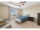 Serene bedroom featuring tray ceilings, neutral tones and a large window with natural light at 2700 Paces Ferry Se Rd # 202, Atlanta, GA 30339