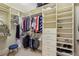 Organized walk-in closet with custom shelving, drawers, and ample storage for clothes and accessories at 2700 Paces Ferry Se Rd # 202, Atlanta, GA 30339