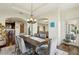 Open dining room with stylish furniture, modern lighting, and seamless flow to other areas at 2700 Paces Ferry Se Rd # 202, Atlanta, GA 30339
