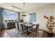 Formal dining room featuring modern chandelier, elegant decor, and natural light at 2700 Paces Ferry Se Rd # 202, Atlanta, GA 30339