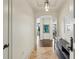 Elegant foyer with tile flooring, decorative lighting, and art leading to open living spaces at 2700 Paces Ferry Se Rd # 202, Atlanta, GA 30339