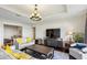 Sophisticated living room with modern furniture, TV, and bright natural light at 2700 Paces Ferry Se Rd # 202, Atlanta, GA 30339