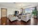 Bright living room with hardwood floors, comfortable seating, and scenic outdoor views at 2700 Paces Ferry Se Rd # 202, Atlanta, GA 30339