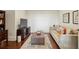 Cozy living room with comfortable seating, dark wooden floors, and a decorative area rug at 2700 Paces Ferry Se Rd # 202, Atlanta, GA 30339