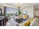 Bright living room with sliding glass doors to a balcony and elegant decor at 2700 Paces Ferry Se Rd # 202, Atlanta, GA 30339