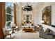 Elegant living room with large windows, neutral tones, and stylish furnishings for a sophisticated ambiance at 2700 Paces Ferry Se Rd # 202, Atlanta, GA 30339