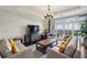 Inviting living room features a large window, balcony, and comfortable seating at 2700 Paces Ferry Se Rd # 202, Atlanta, GA 30339