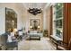 Inviting living room featuring large windows, comfortable seating, and tasteful decor for an upscale, cozy feel at 2700 Paces Ferry Se Rd # 202, Atlanta, GA 30339